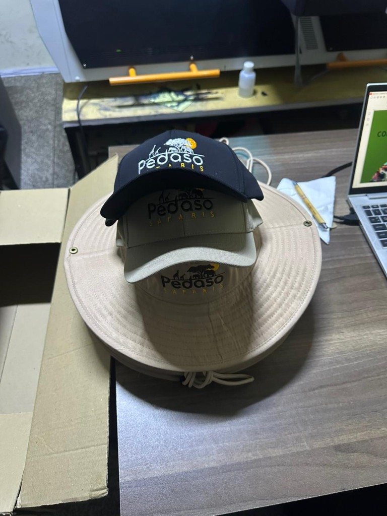 Branded safari hats and caps for Pedaso Safaris.